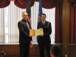 Cadet Ian McQuaid (r), Cedarville University, chapter $500 scholarship winner, receives his award from Scott Fauch, chapter ROTC liaison, in May.   